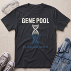 A black graphic t-shirt laid flat on a light beige textured background, surrounded by lifestyle props including safety goggles, gray sneakers, and a denim jacket. The t-shirt features a white and blue DNA double helix graphic with the text 'GENE POOL' and 'NO LIFEGUARD ON DUTY'.