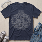 A navy blue botanical t-shirt featuring an intricate tree root illustration with the pun “I’m Rooting For You” in bold vintage-style lettering.