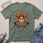 A sage green graphic t-shirt laid flat on a textured beige fabric background, styled with clear safety goggles, gray sneakers, and a blue denim jacket. The t-shirt features a central graphic of a skull wearing a beret and crossbones, with the text 'REBEL ASTRONOMY DISCIPLINE' and 'E Pur Si Muove - 1633'.
