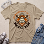 A beige graphic t-shirt laid flat on a textured fabric background, styled with safety goggles, gray sneakers, and a blue denim jacket. The t-shirt features a retro-style astronomy-themed graphic with a skull, crossed telescopes, and the text 'REBEL ASTRONOMY DISCIPLES' and 'E Pur Si Muove - 1633'.