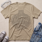 A beige botanical t-shirt featuring an intricate tree root illustration with the pun “I’m Rooting For You” in bold vintage-style lettering.