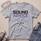 A heather gray graphic T-shirt laid flat on a light wood surface, styled with safety goggles, sneakers, and a denim jacket. The shirt reads “SOUND ADVICE” in black and purple text above a wavelength graphic and the equation v = fϗϙ.