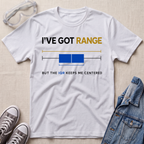 A white graphic t-shirt laid flat on a light beige textured surface, styled with safety goggles, gray sneakers, and a denim jacket. The t-shirt features a graphic with the text 'I'VE GOT RANGE BUT THE IQR KEEPS ME CENTERED' and a blue box plot illustration.